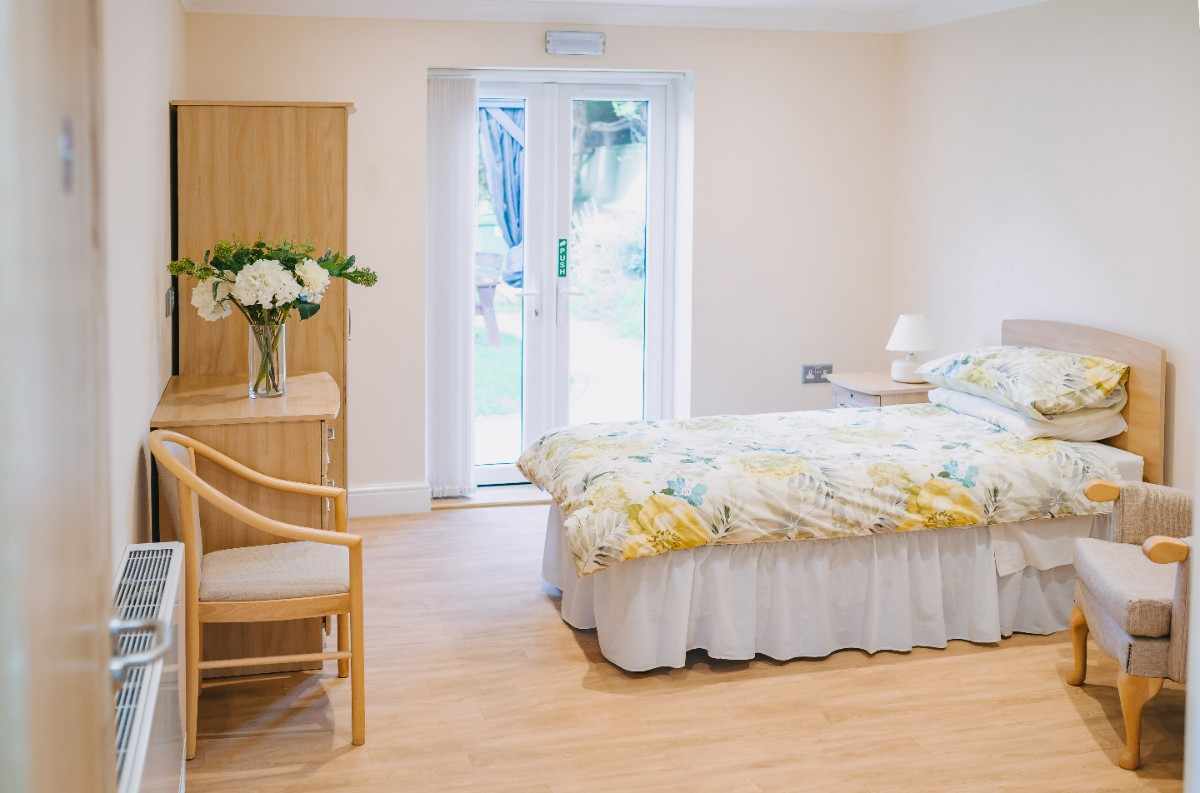 Comfortable bedroom at Swn-y-Gan nursing home Swansea